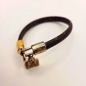 Louis Vuitton Lock Bracelet Monogram Alma Gold Brown Bracelet